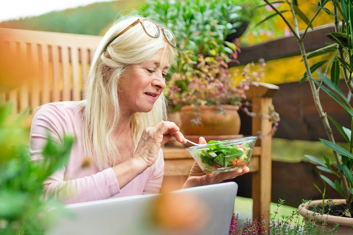 Woman eating salad