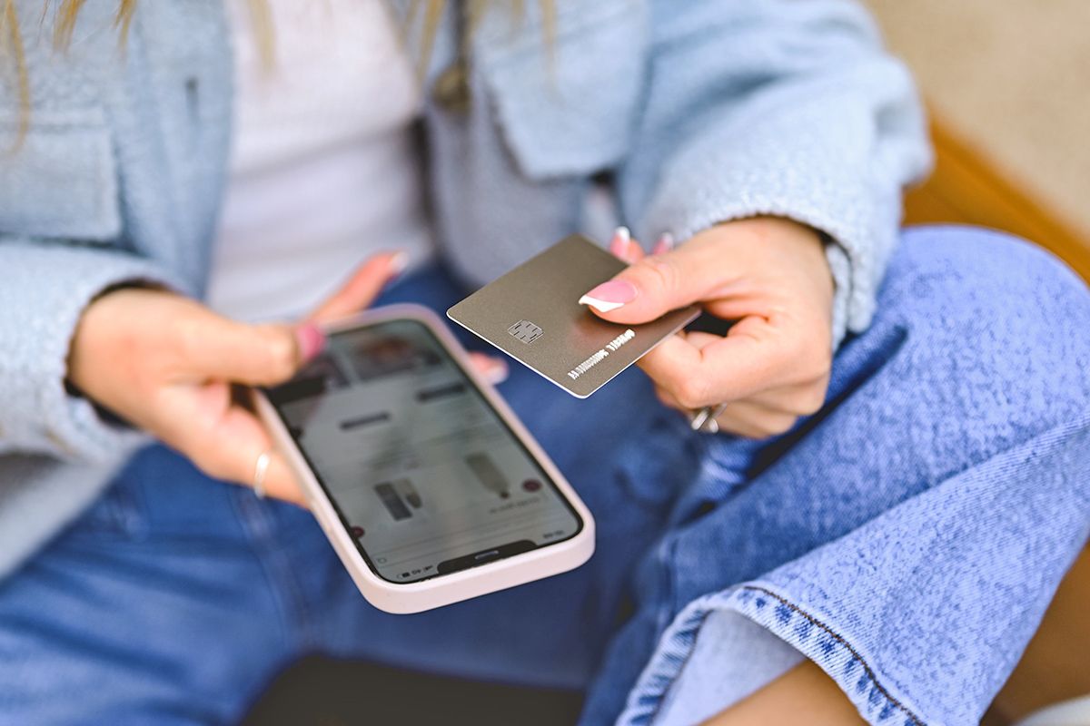 Woman shopping on phone with credit card