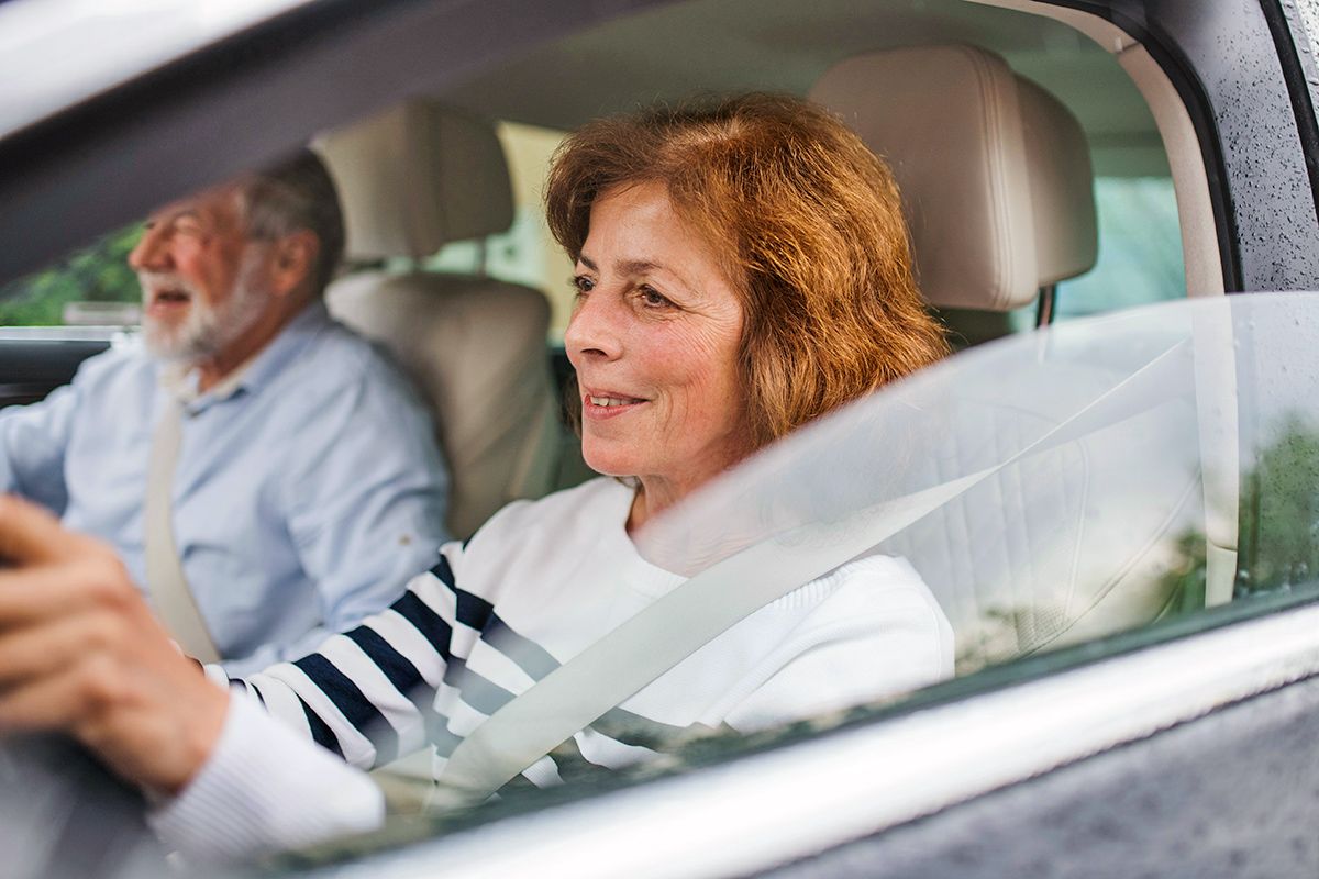 Older woman driving car