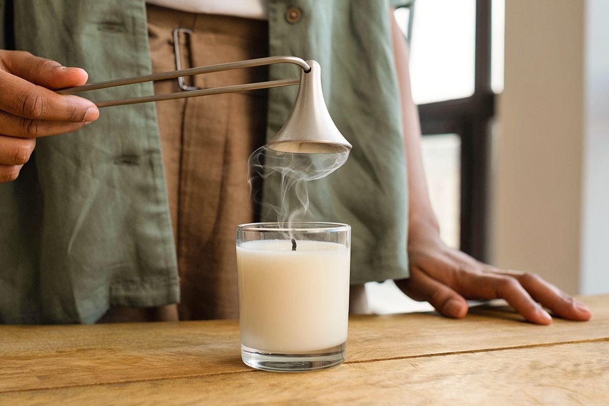 Putting out candle