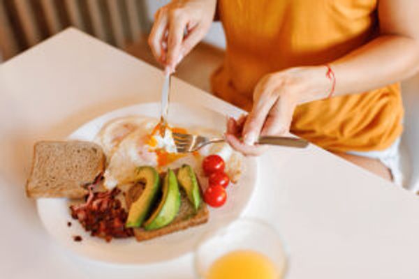 Person eating breakfast