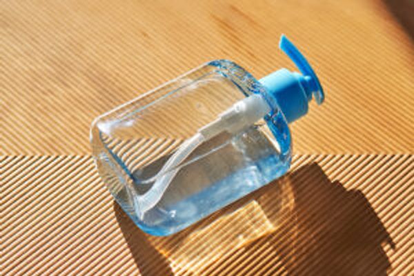 Bottle of hand sanitizer on the ground