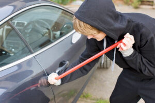 Person breaking into a car