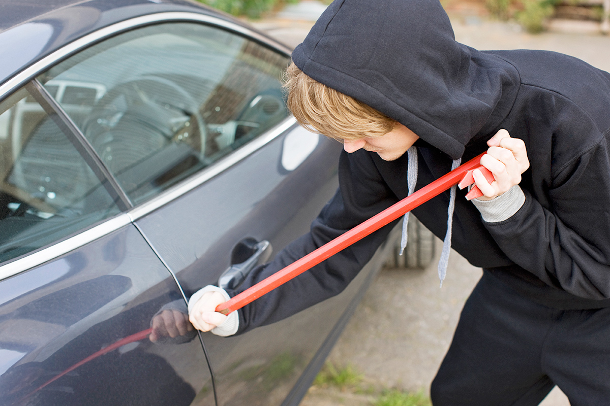 Person breaking into a car
