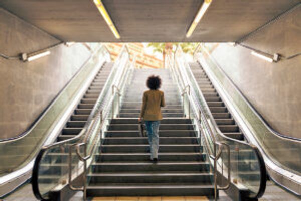Woman walking up the stairs