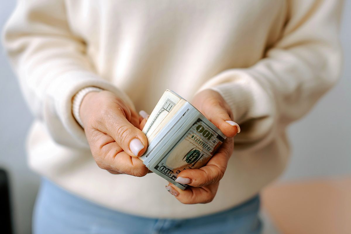Person holding cash