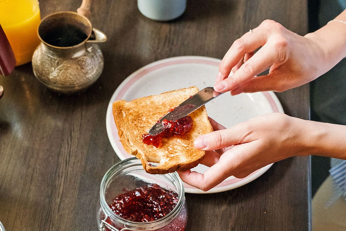 Spreading jam on toast