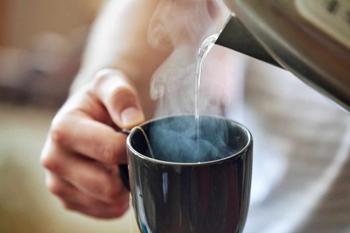 Pouring hot water into a mug