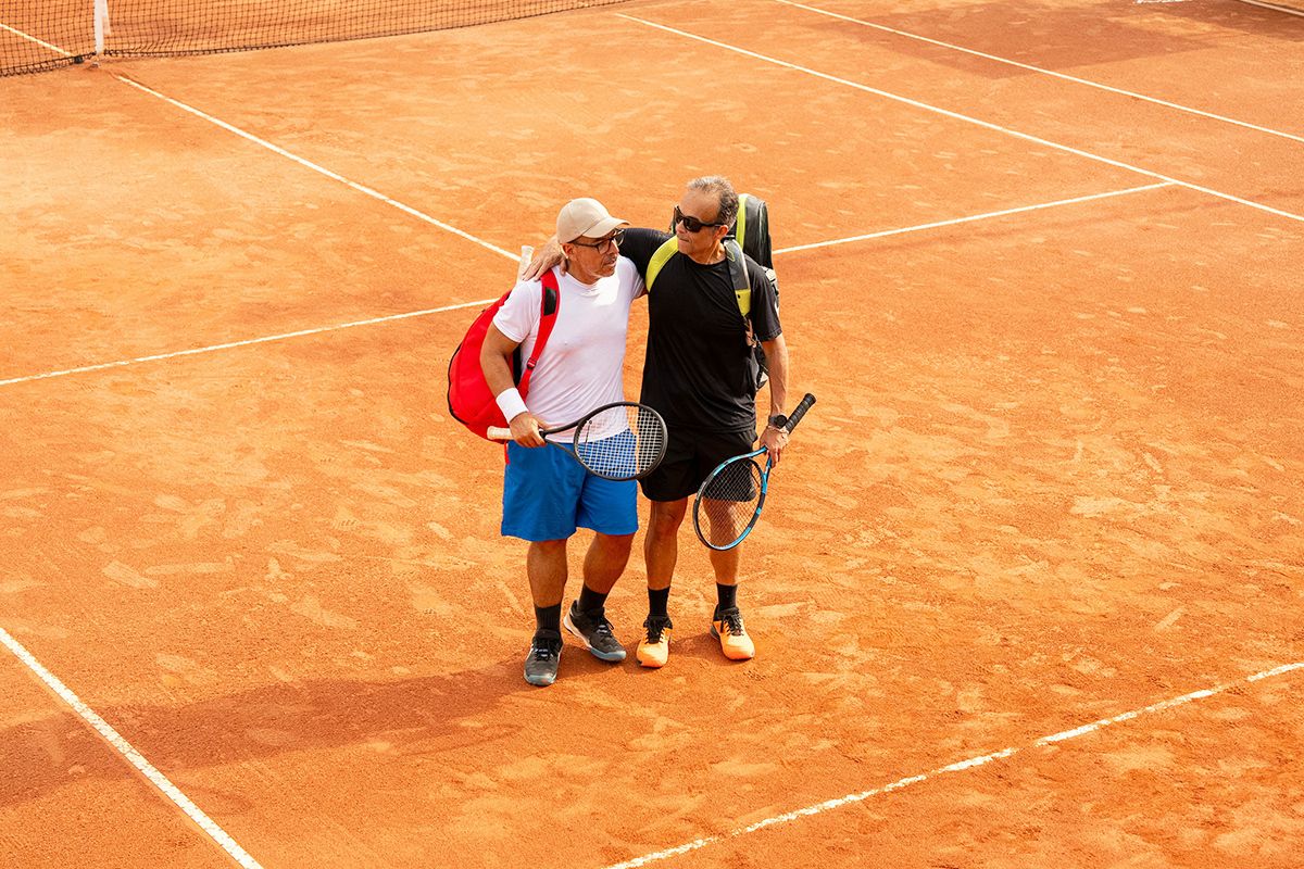 Two men playing tennis
