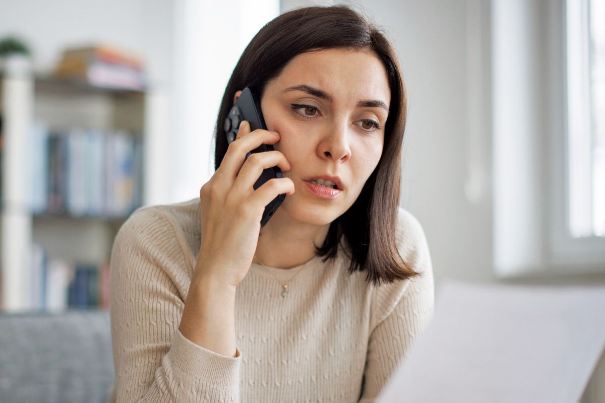 Frustrated woman on phone