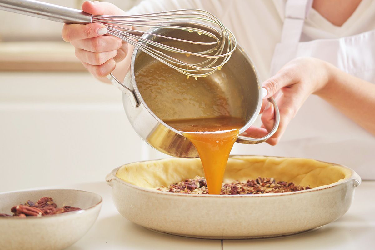 Woman making pecan pie