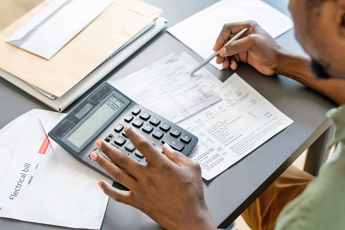Man with bill and calculator