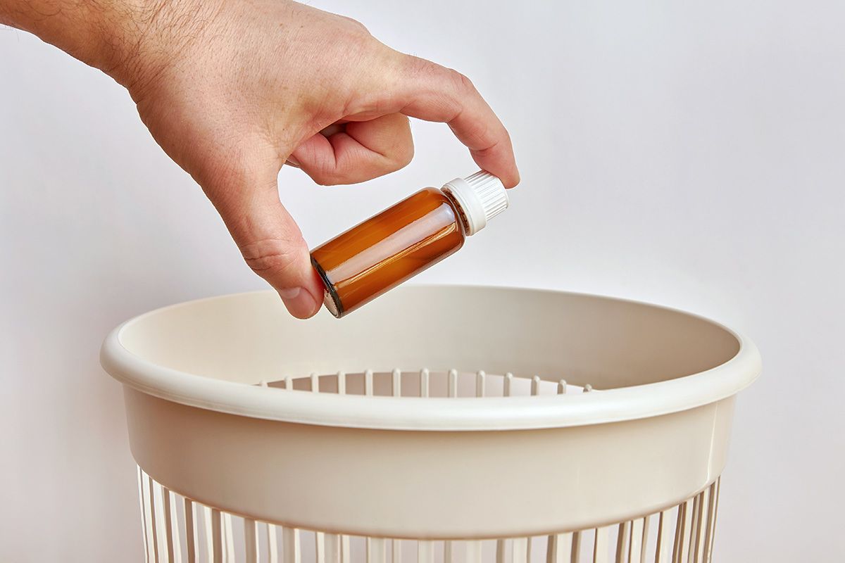 throwing bottle in the trash