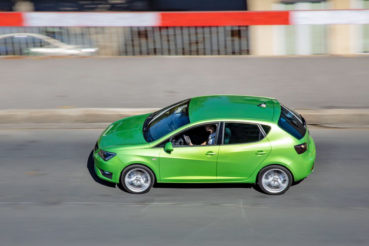 Green car on the road