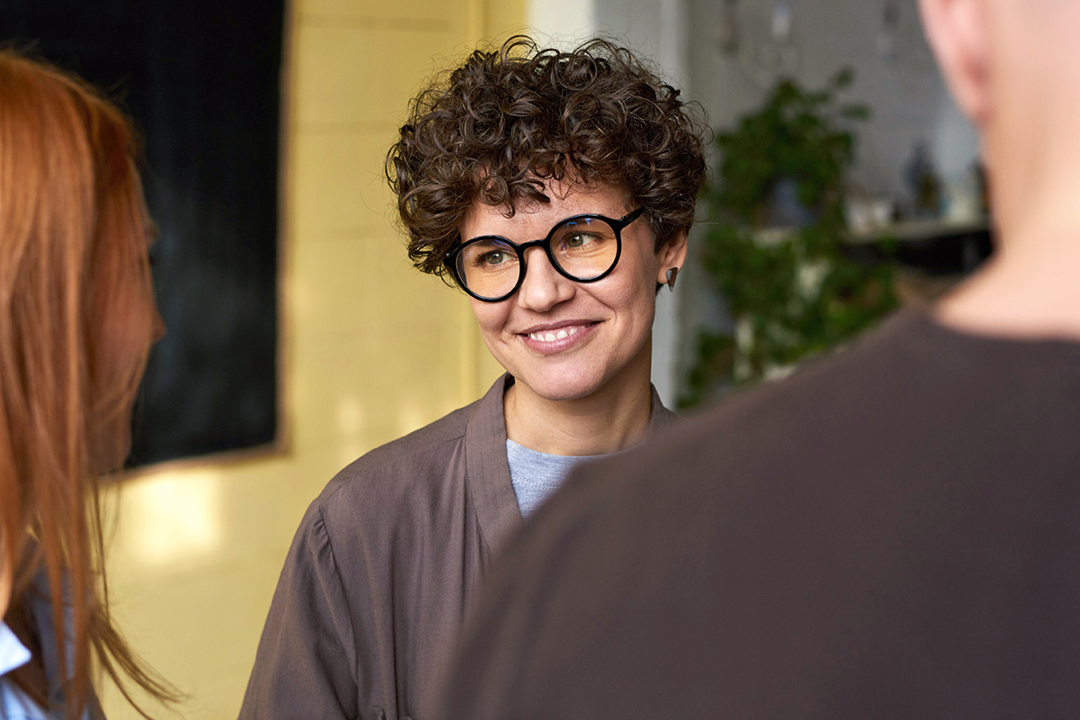 Person smiling at someone else