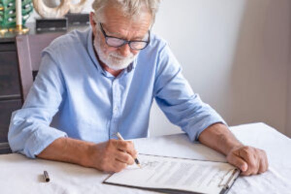 Man filling out paperwork