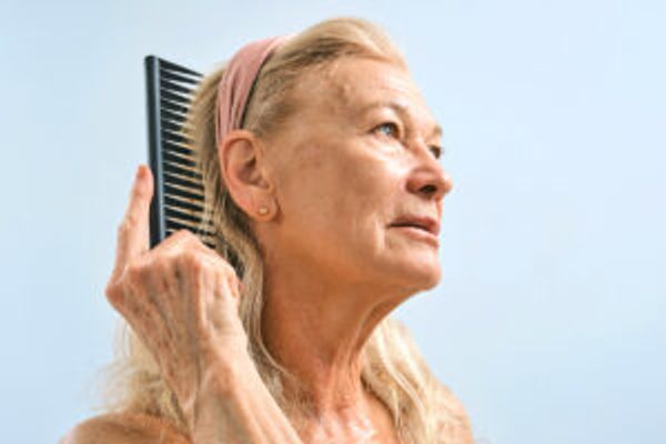Woman brushing hair