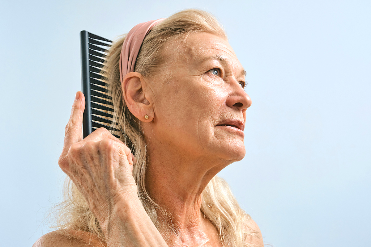 Woman brushing hair