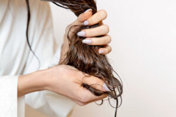 Woman holding wet hair